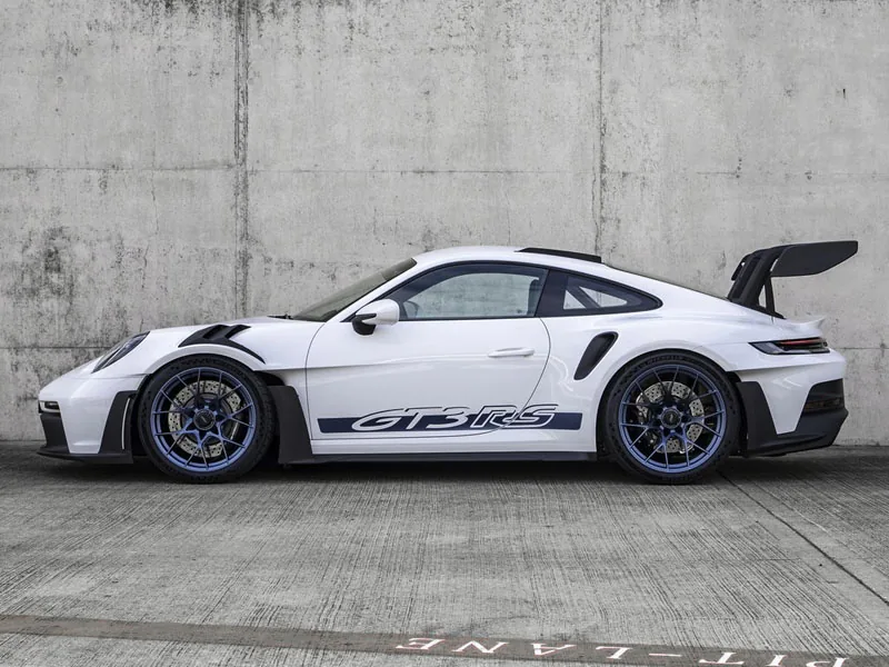 A white Porsche 911 GT3 RS in the pit lane